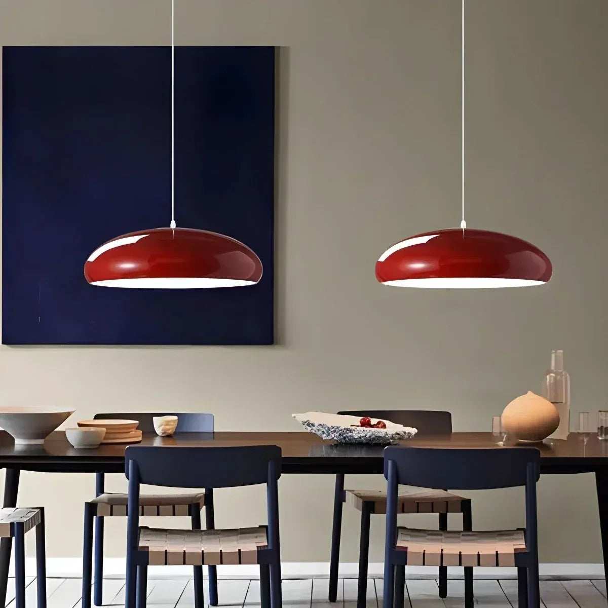 Pair of wine red Lola glossy dome pendant lights above a dining table