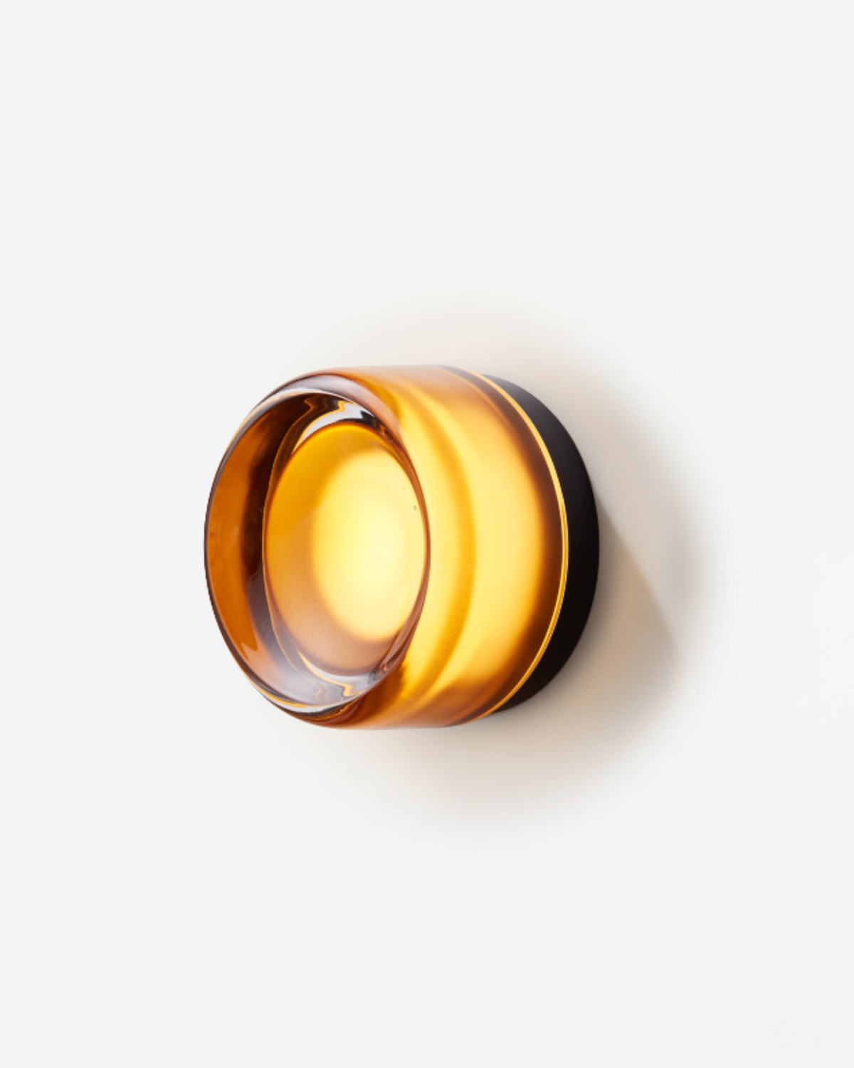 Orla round LED wall light with smooth amber shade
