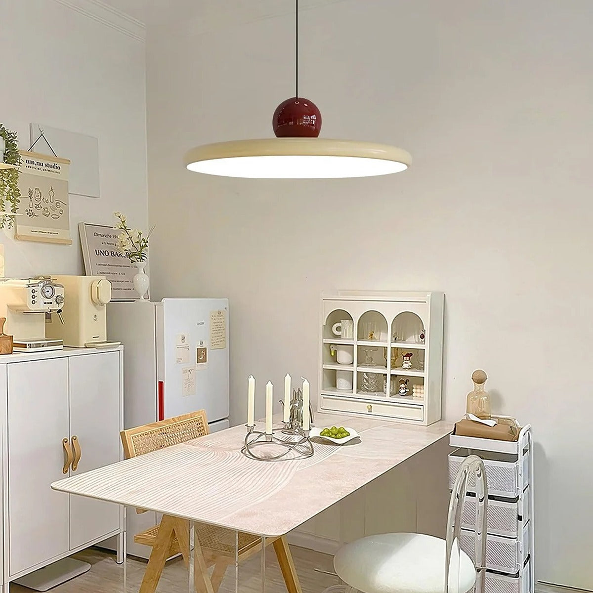 Cream and red Juno saucer pendant light over a kitchen table