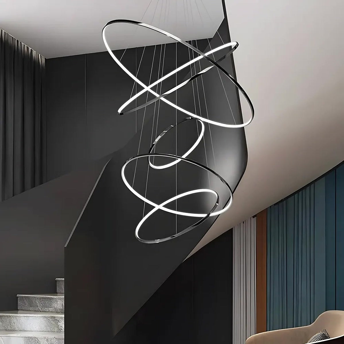 Black Vela LED ring chandelier with 5 rings in a staircase