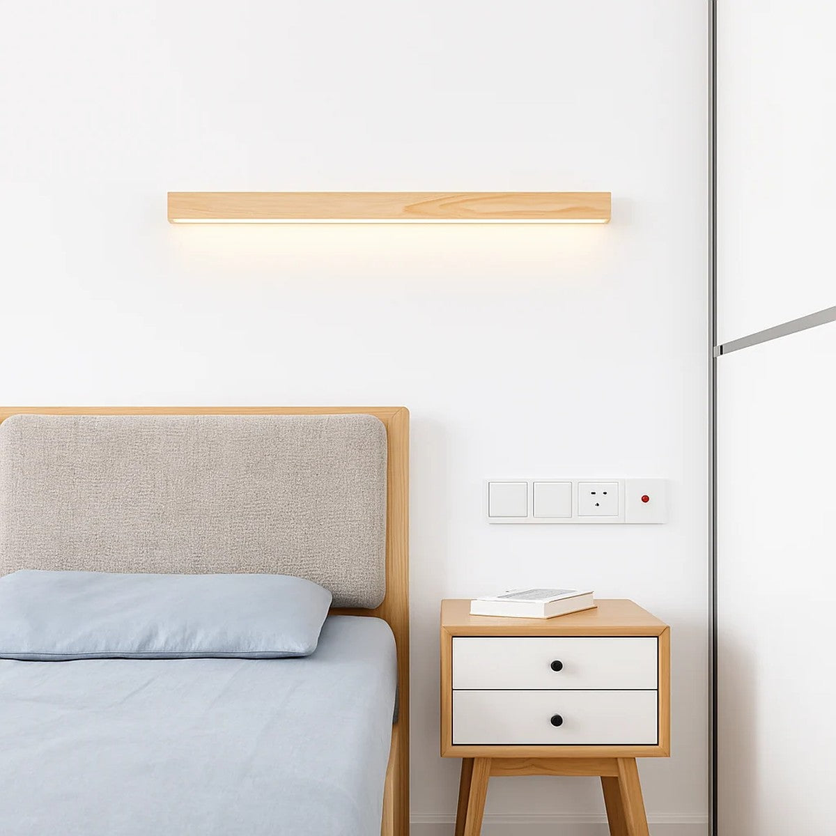 Kauri natural wood linear wall light above a bed and nightstand