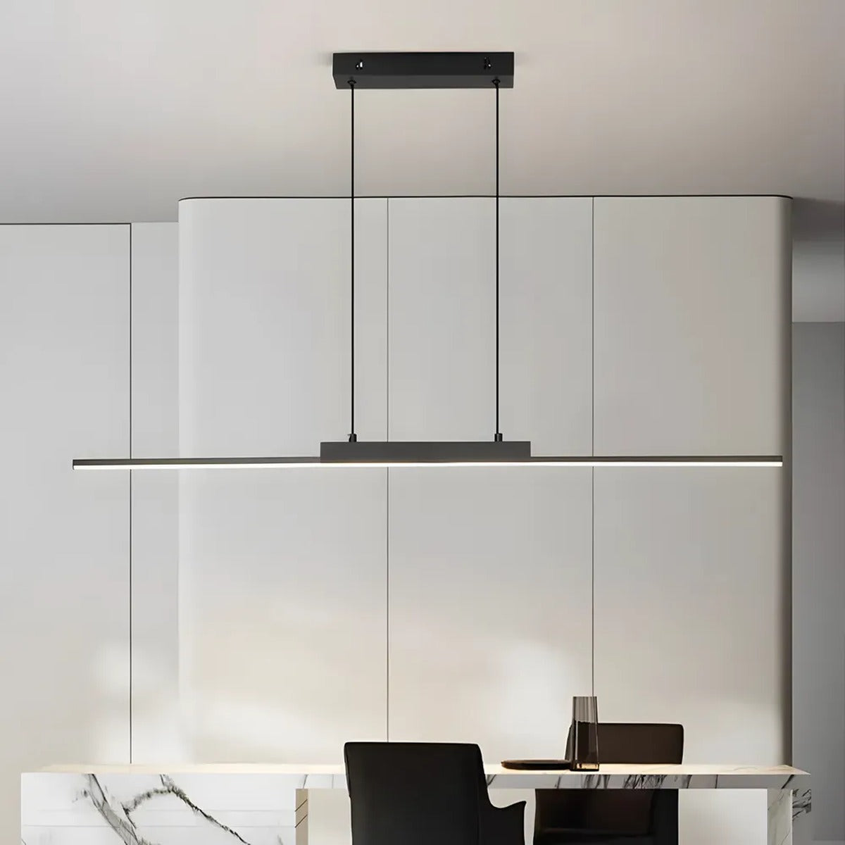 Elio black linear pendant light over a white kitchen island