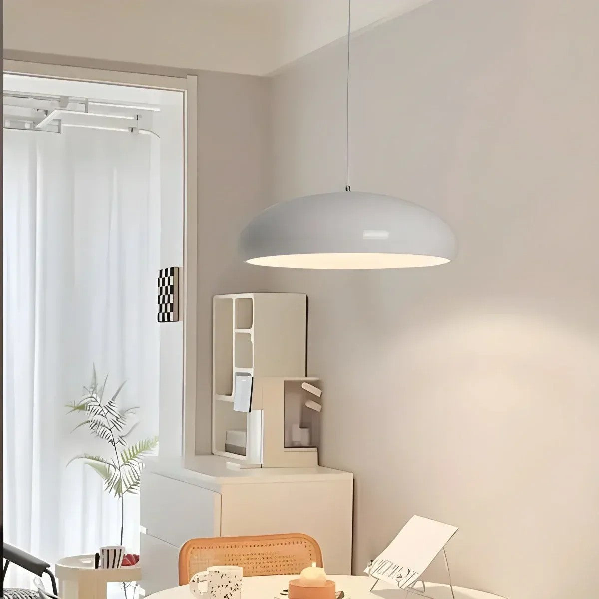 White Lola glossy dome pendant light in a bright dining room