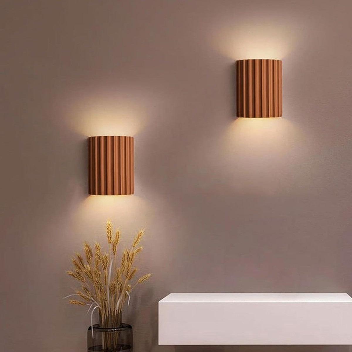 Pair of terracotta Nell fluted wall sconces in an entryway