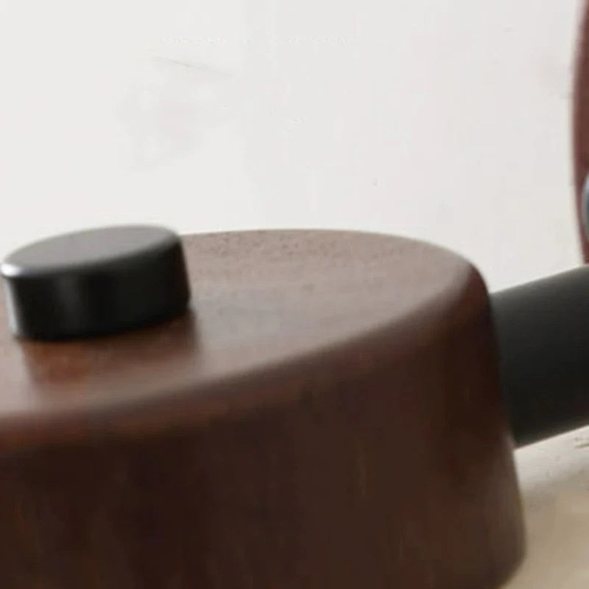 Push-button switch on the Cairn travertine wall sconce