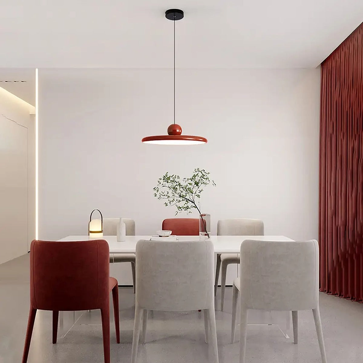 Red Juno saucer pendant light in a dining room
