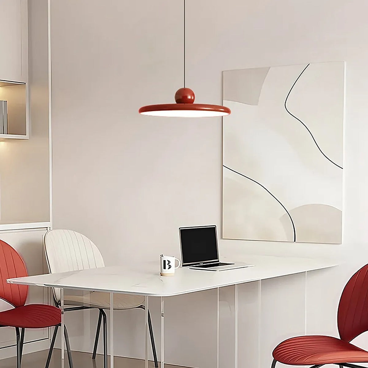 Red Juno saucer pendant light above a home office desk