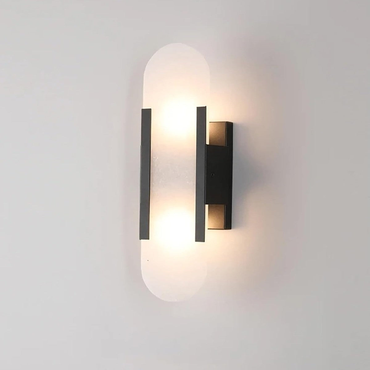 Pietra black finish stone wall sconce lit