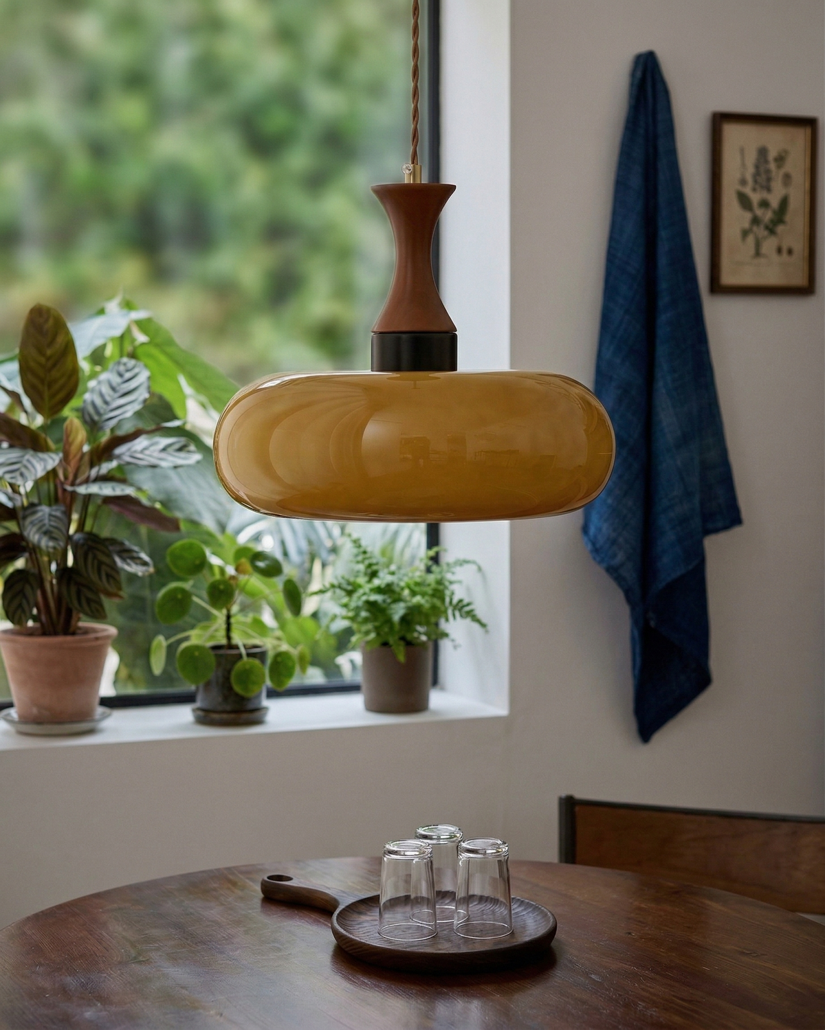 Ovia amber glass pendant near a kitchen window