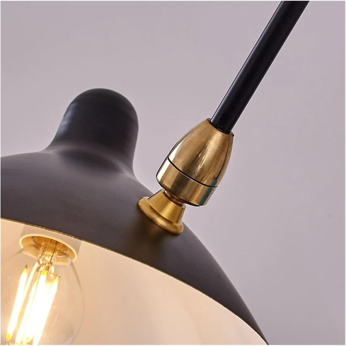 Corella black shade on a brass-tone swivel joint