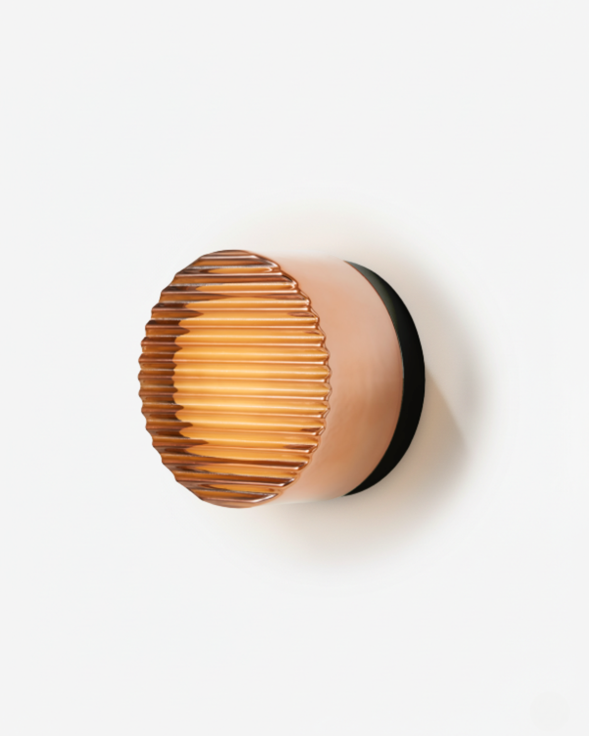 Orla round LED wall light with amber ribbed shade