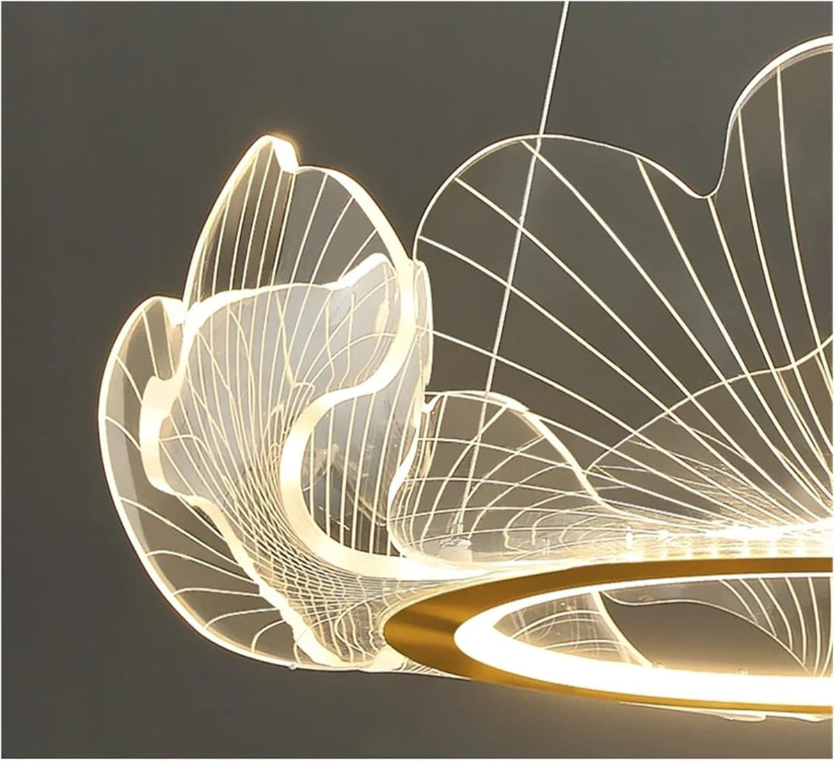Close-up of the glowing clear acrylic ginkgo leaves on the Elara chandelier