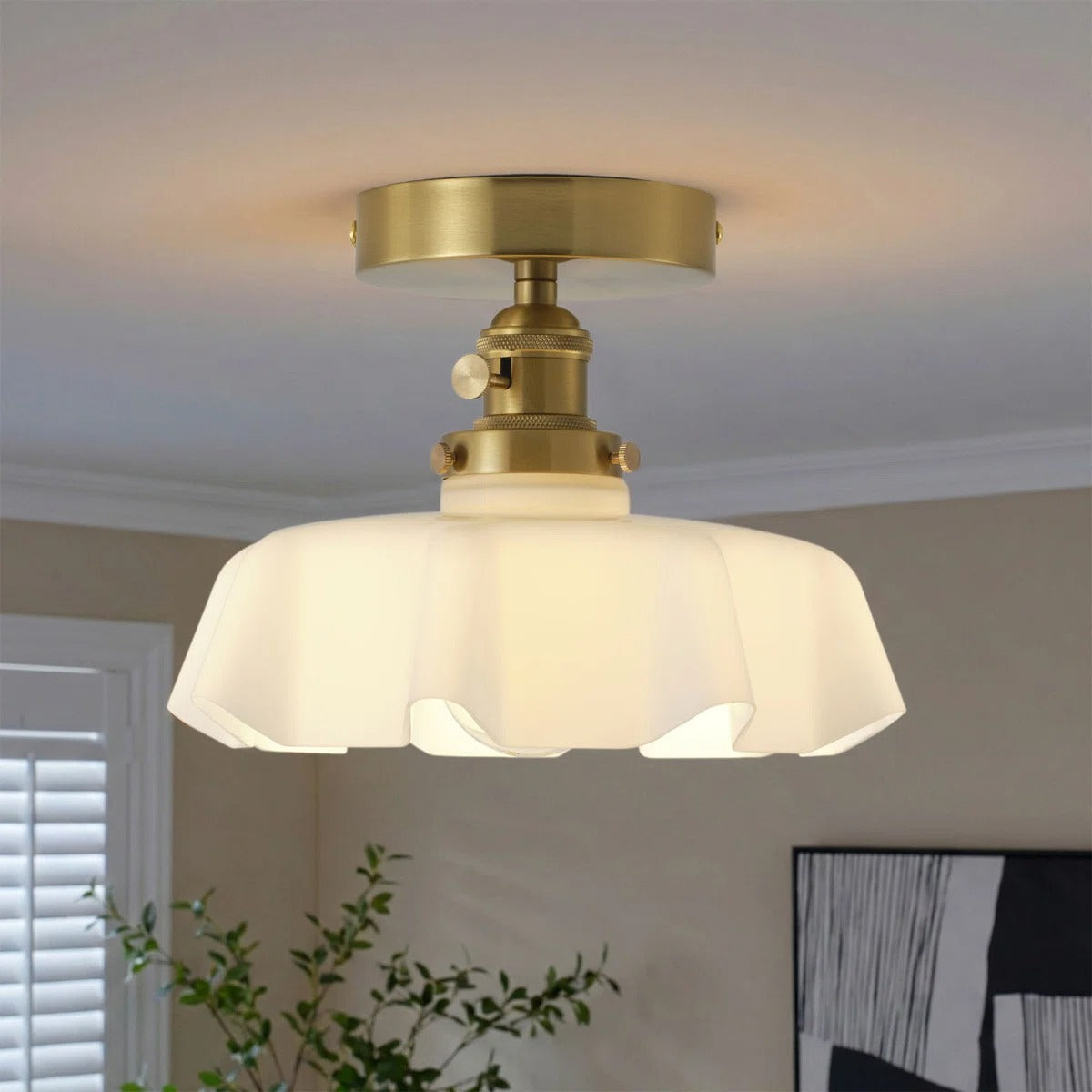 Fleur white scalloped glass semi-flush light on a bedroom ceiling