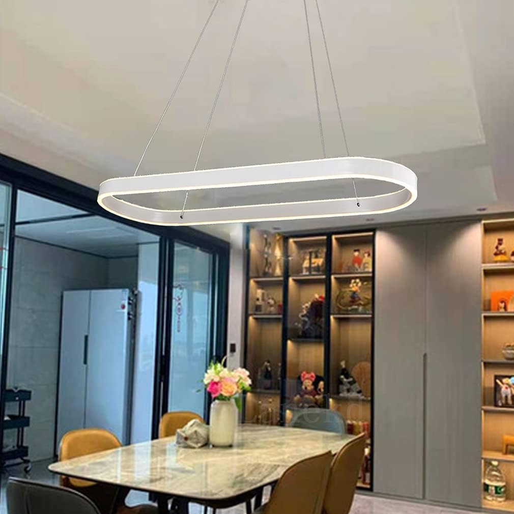 Halo oval LED pendant light in white over a marble dining table in a modern home