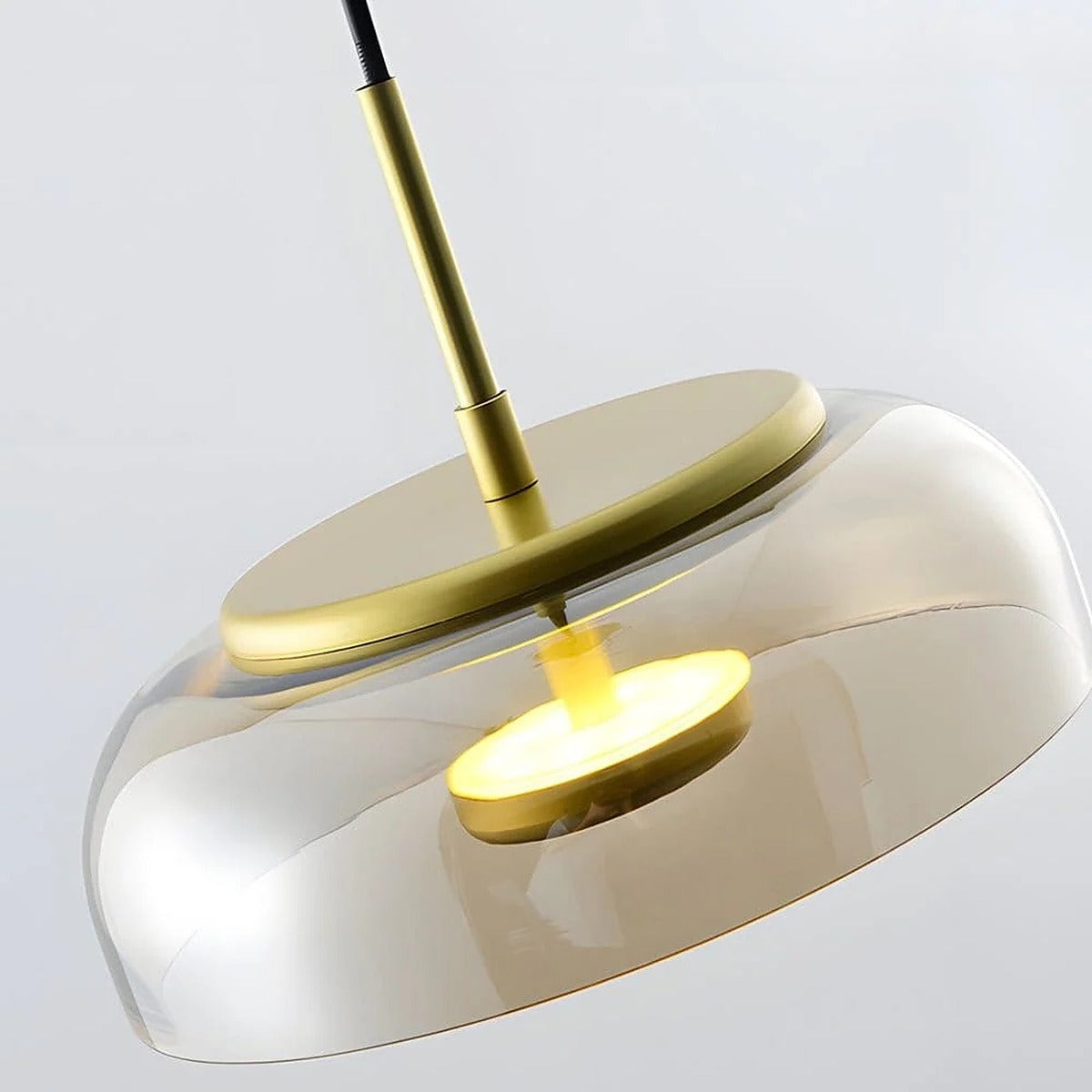 Detail of the Ivy amber glass bowl and floating LED disc