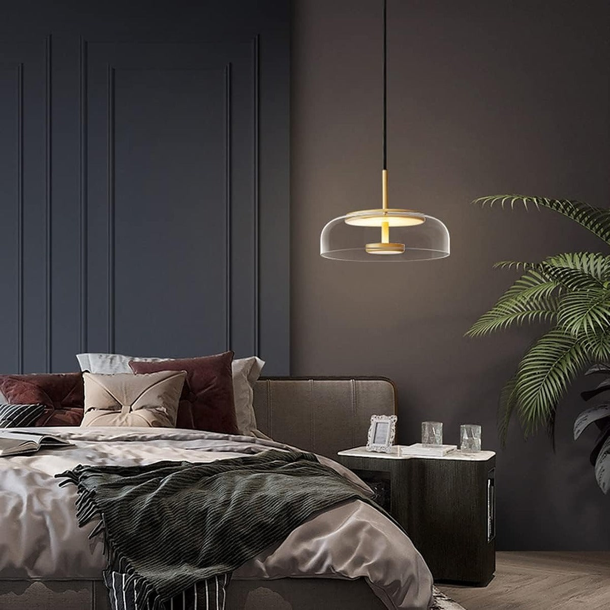 Ivy clear glass LED pendant light in a bedroom