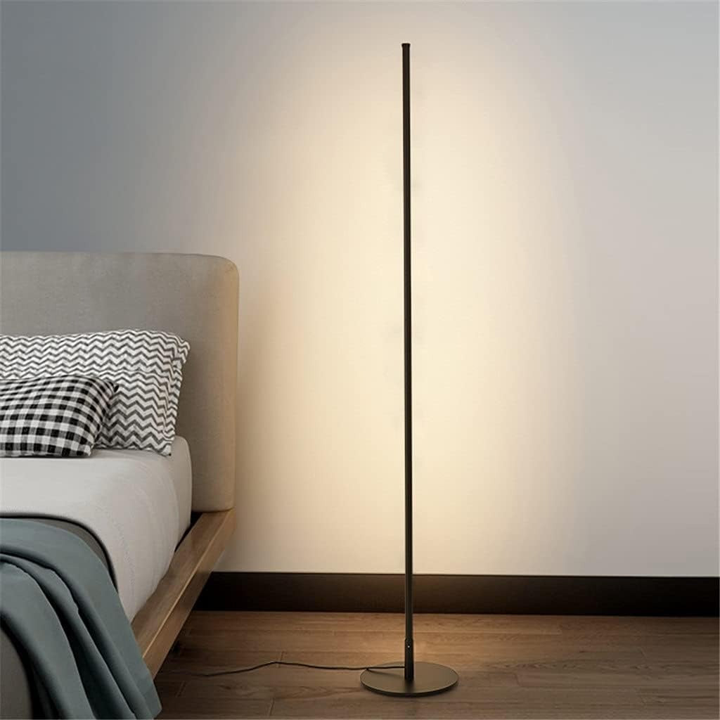 Linear Slim LED corner floor lamp beside a bed in a modern bedroom