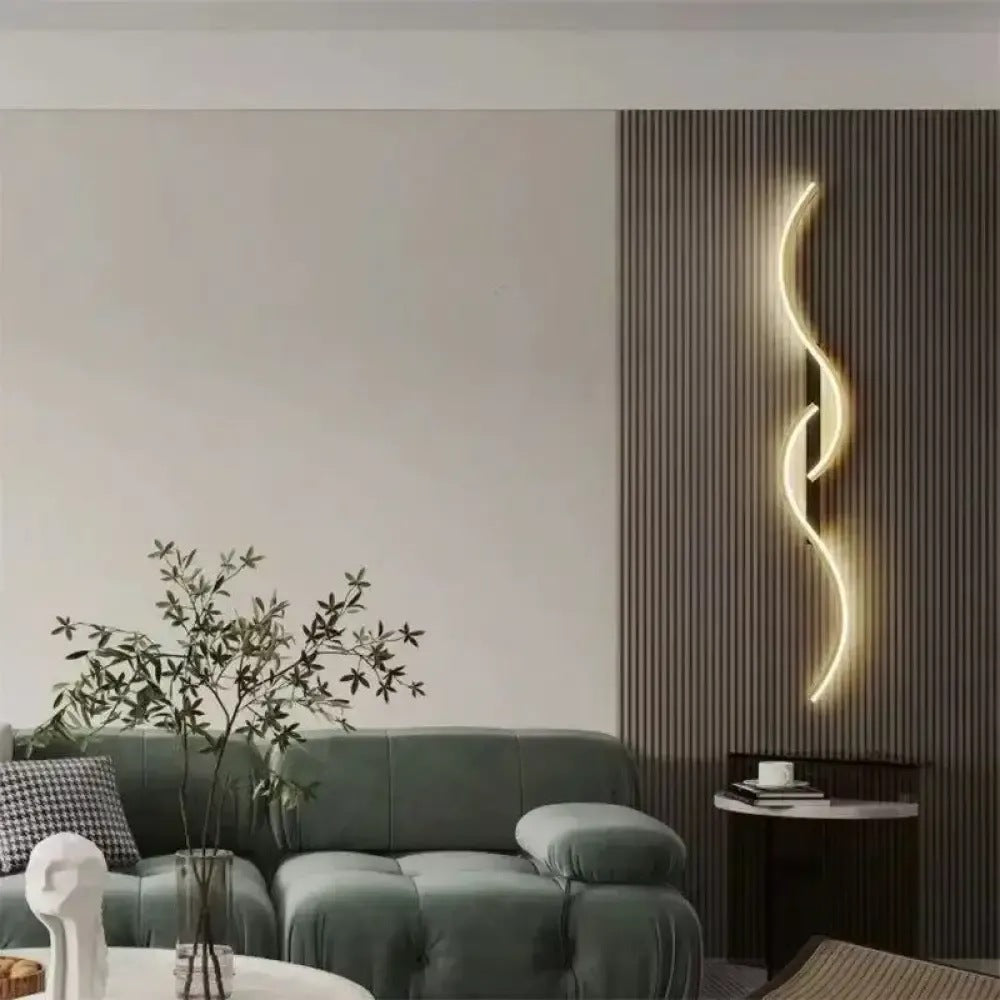 Lyra wave LED wall sconce lit on a slatted wall in a living room