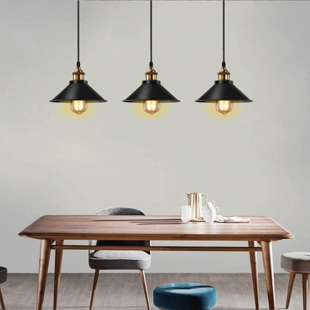 Three Orrin black cone pendants in a row over a modern wood dining table