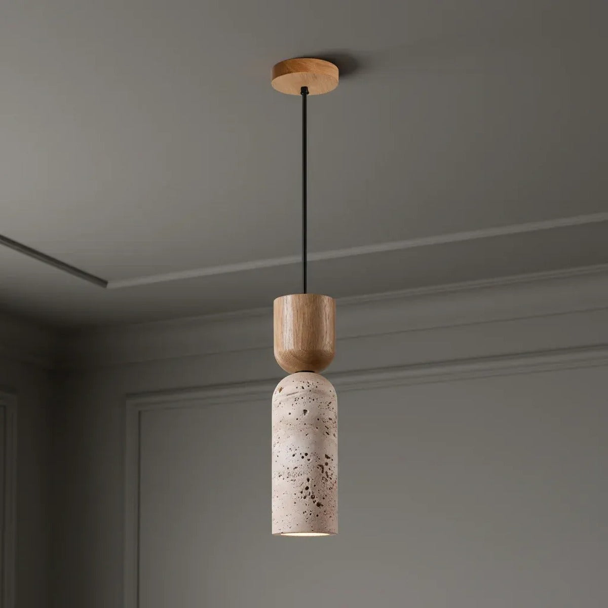 Pia natural travertine mini pendant light with a light wood cap and canopy