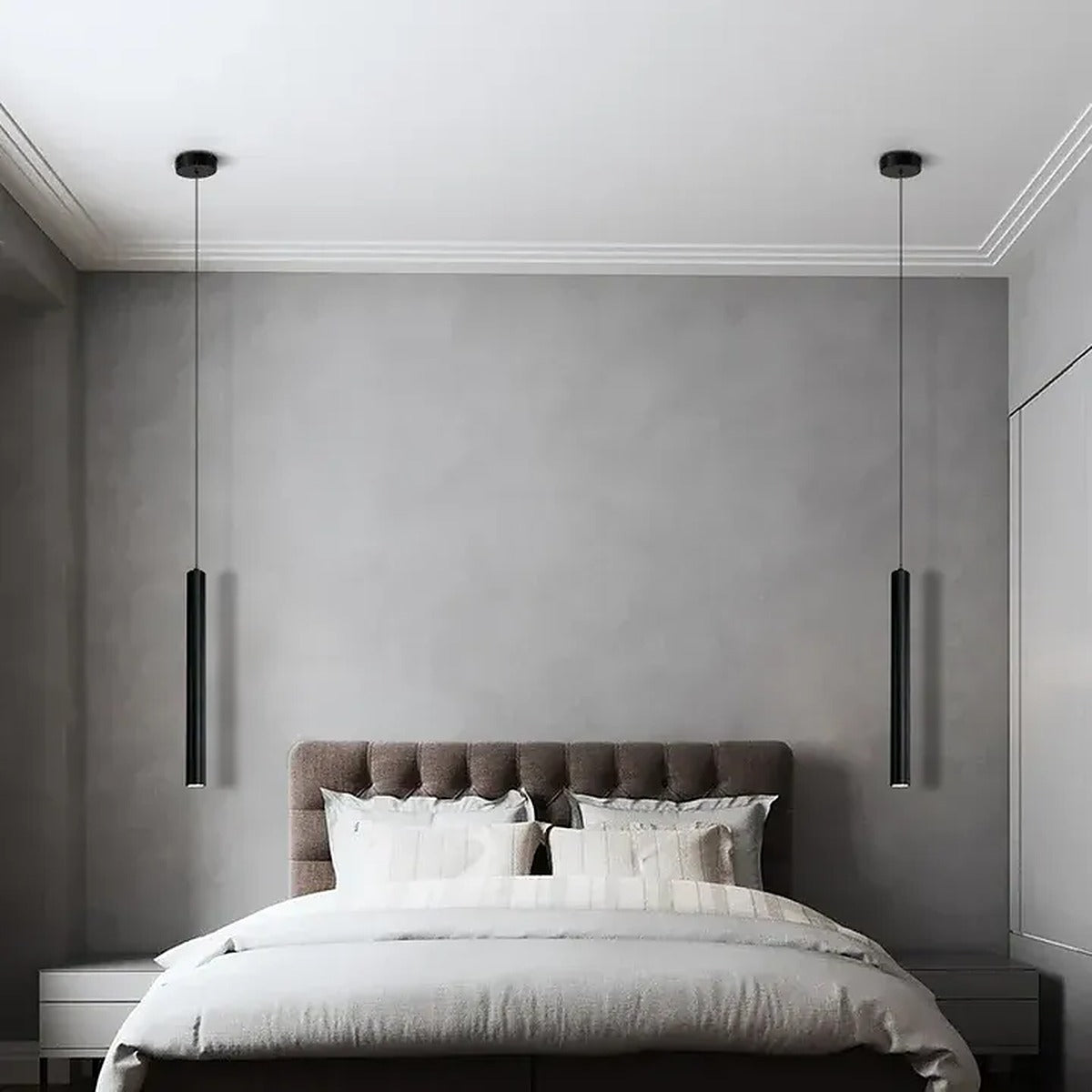 Two Pike black tube pendant lights on each side of a bed