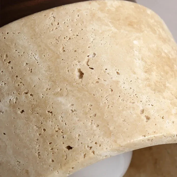 Close-up of the Tova ceiling light showing the natural pores in the travertine shade