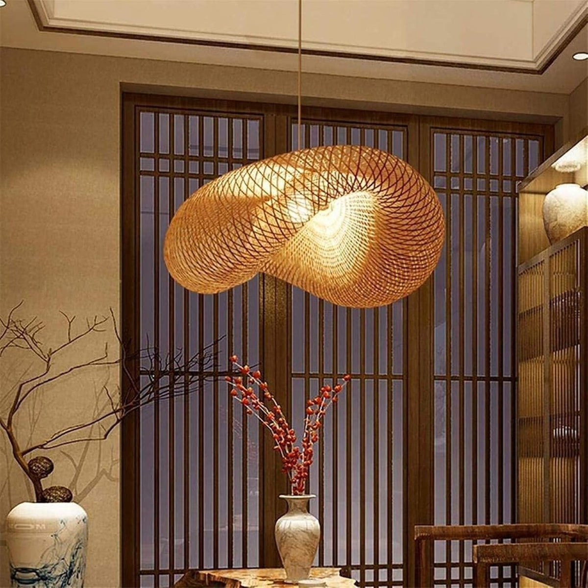 Nami woven bamboo wave pendant light in a room with wooden lattice screens