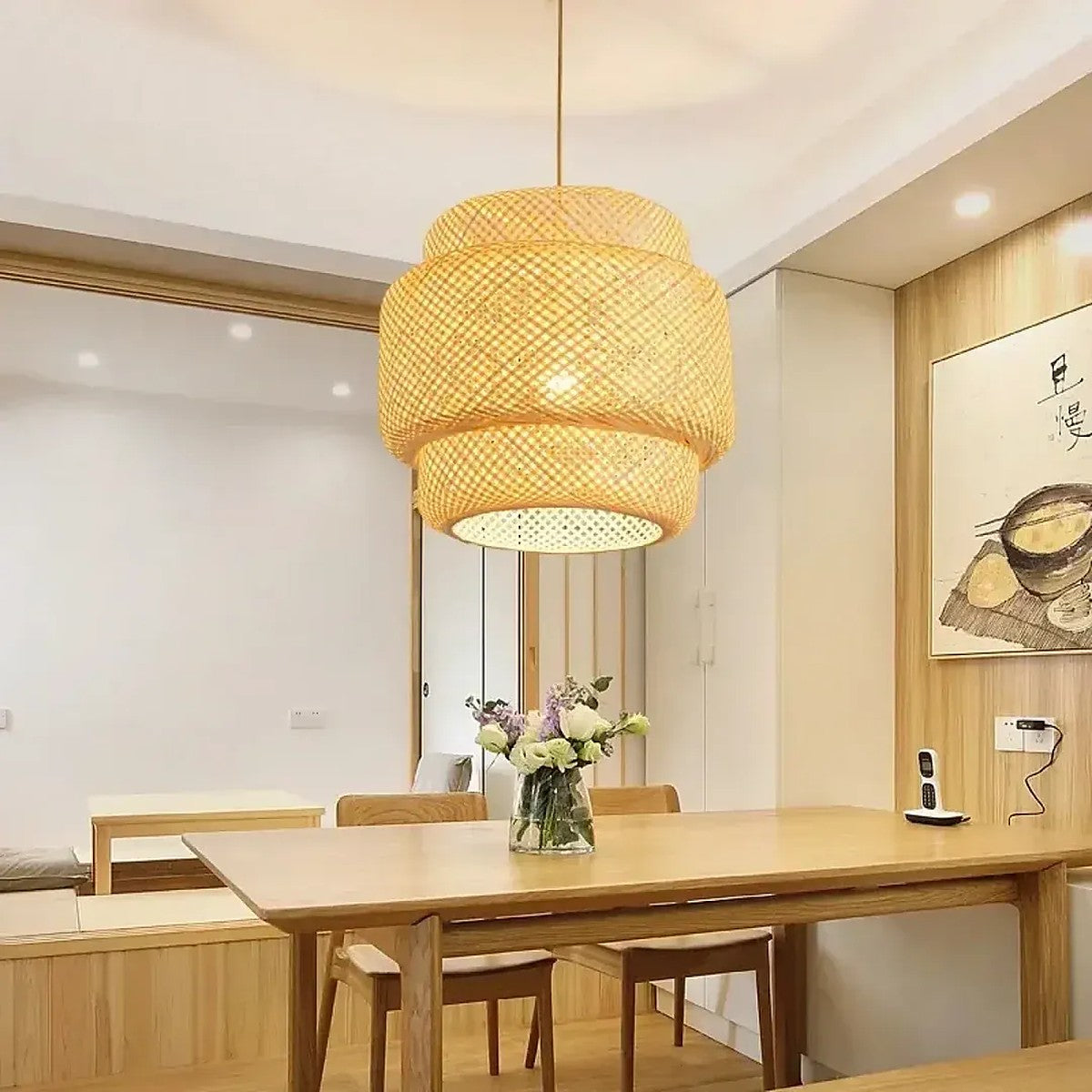 Toki three-tier woven bamboo pendant light over a wooden dining table