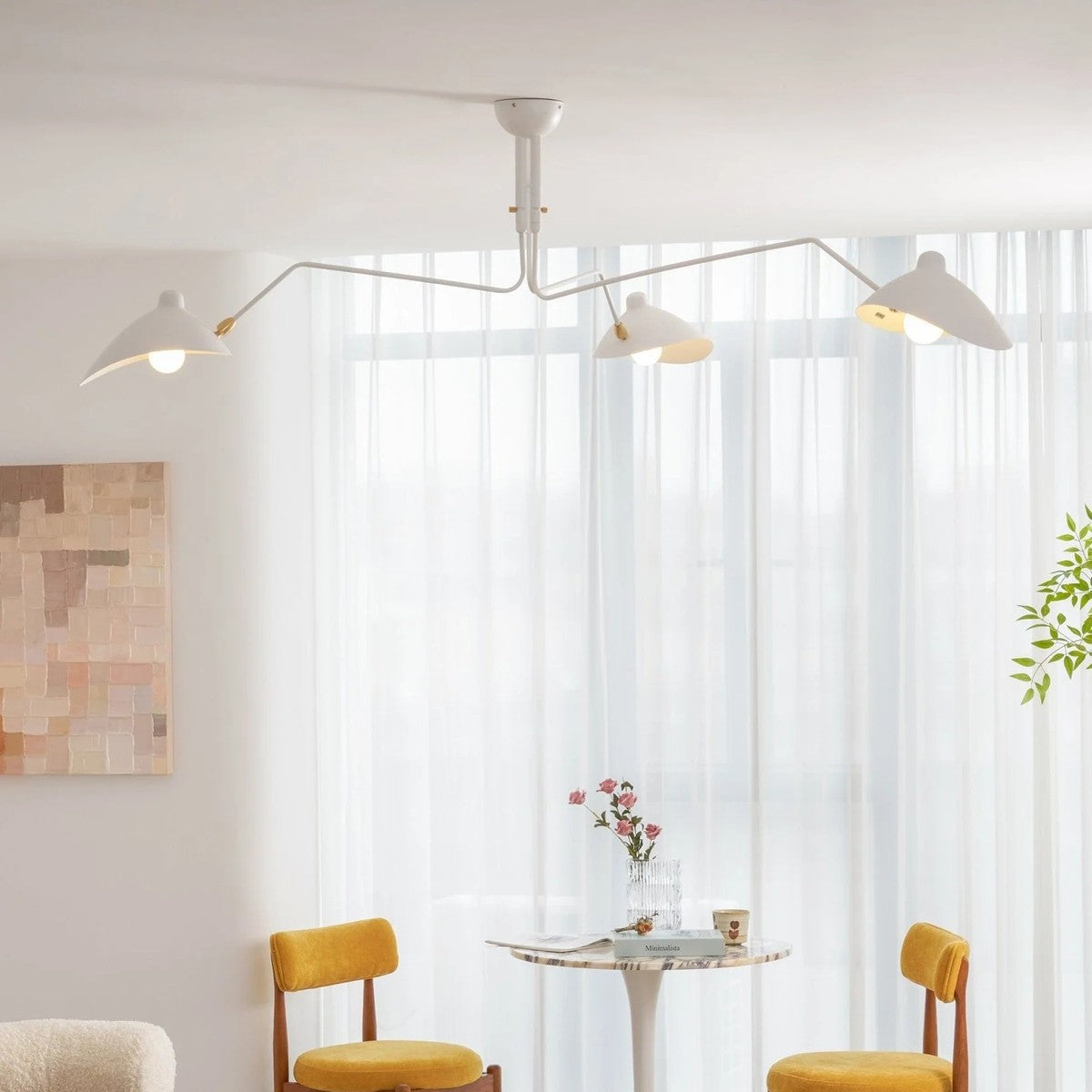 Corella 3-light white spider ceiling light over a dining nook