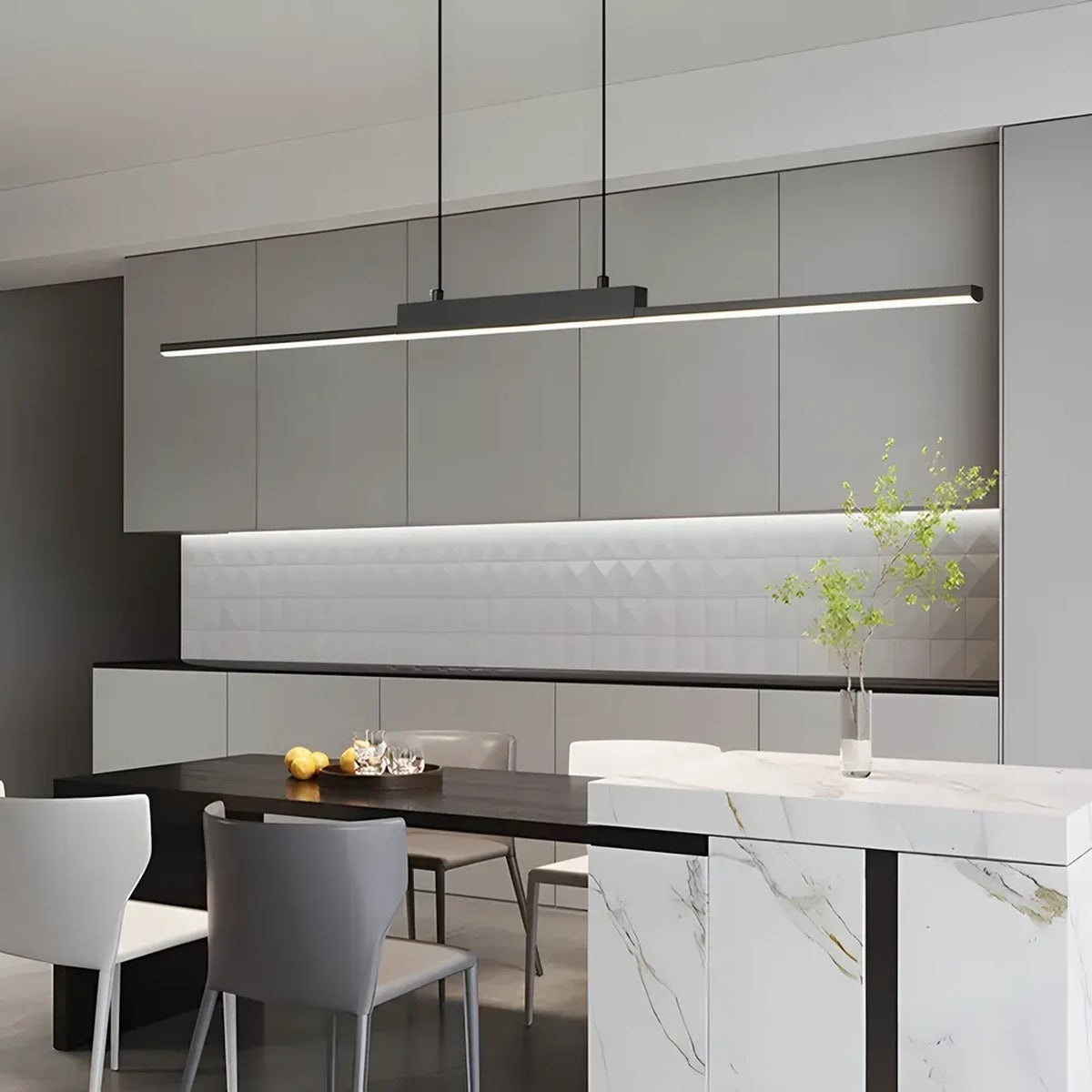 Elio black linear LED pendant light over a marble kitchen island