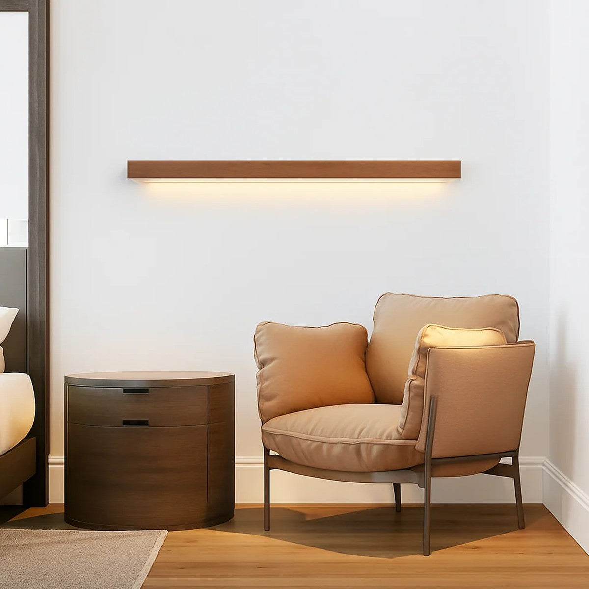Kauri linear LED wall light in walnut finish above an armchair