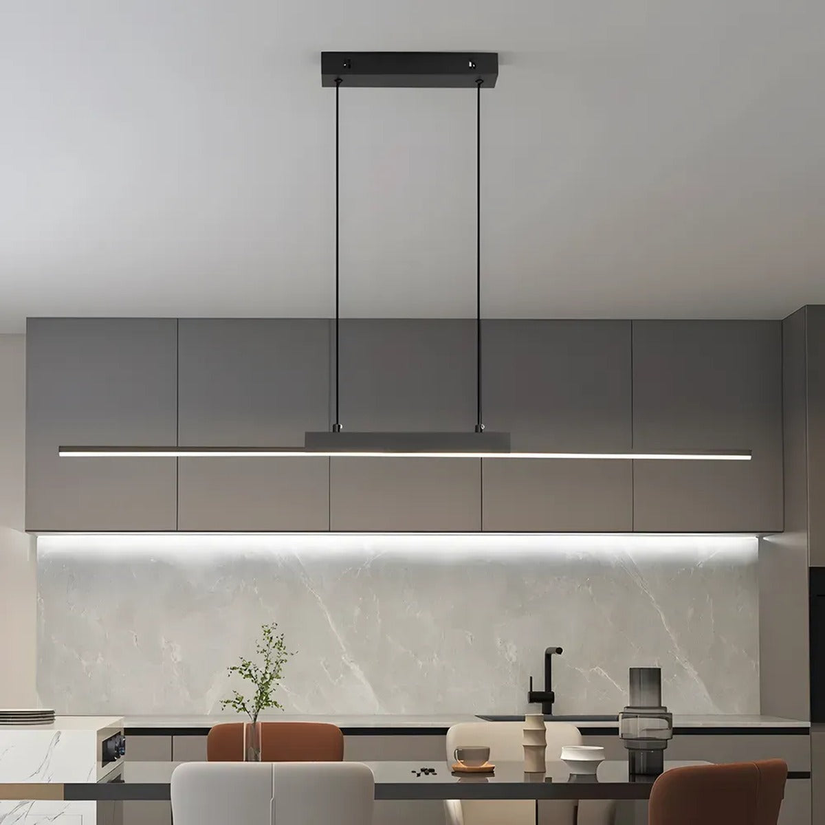 Elio linear LED pendant light above a kitchen dining table