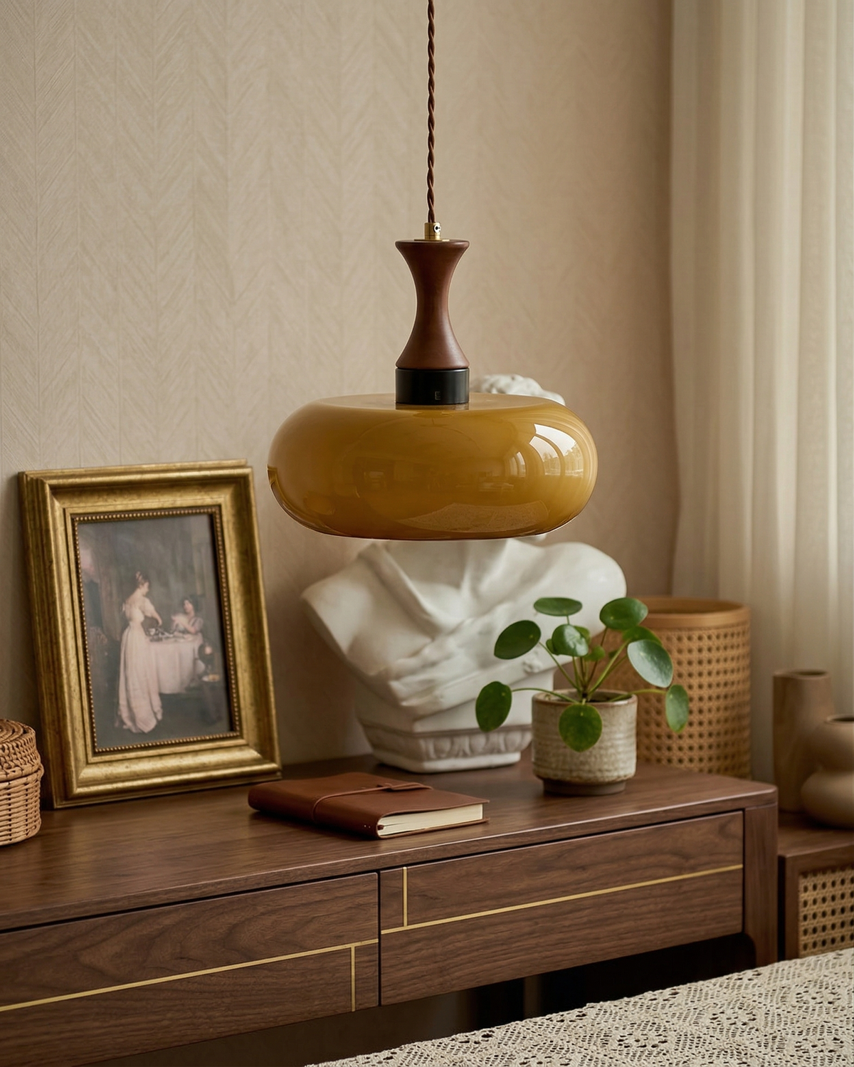 Ovia amber saucer pendant above a wooden console