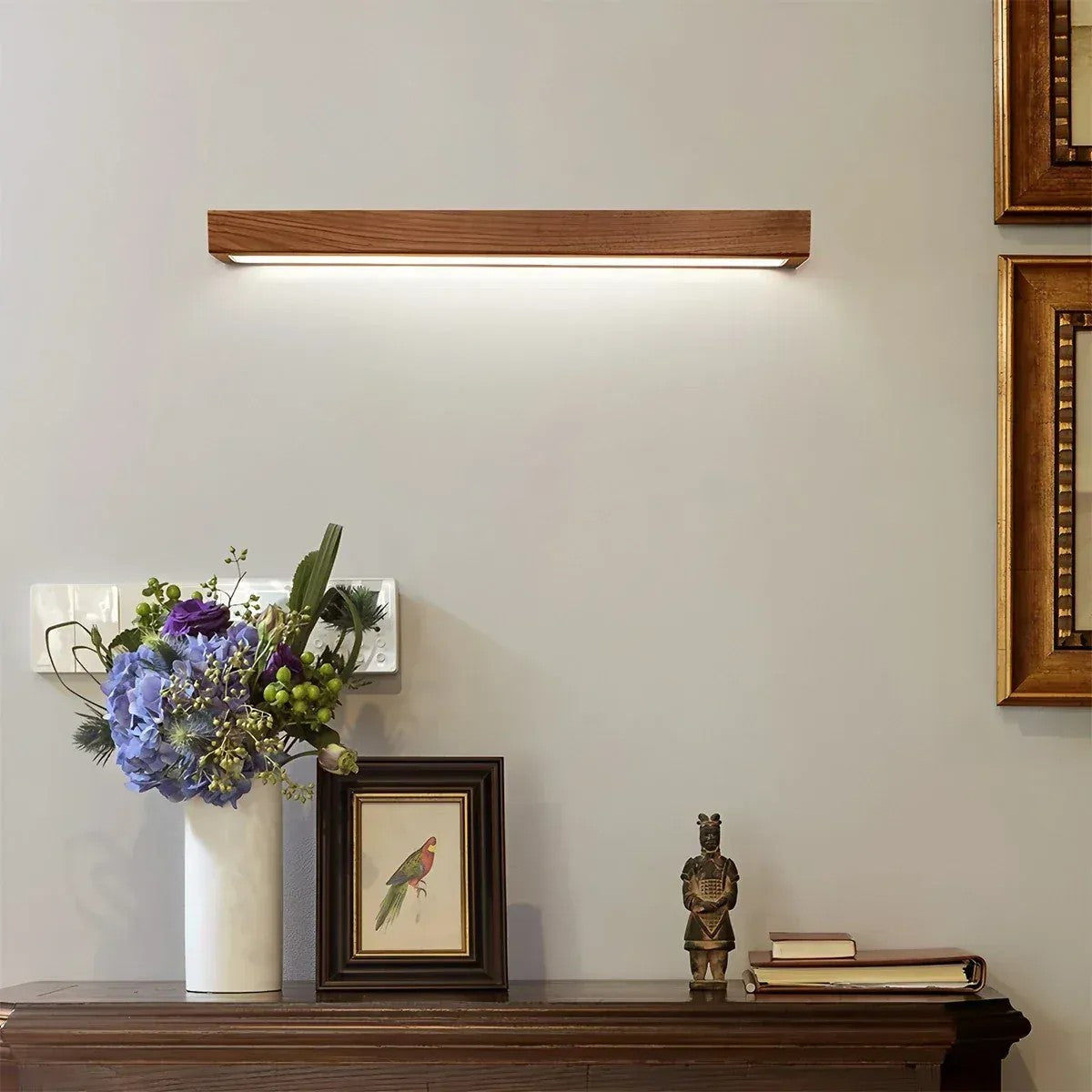 Kauri walnut linear LED wall light above a sideboard
