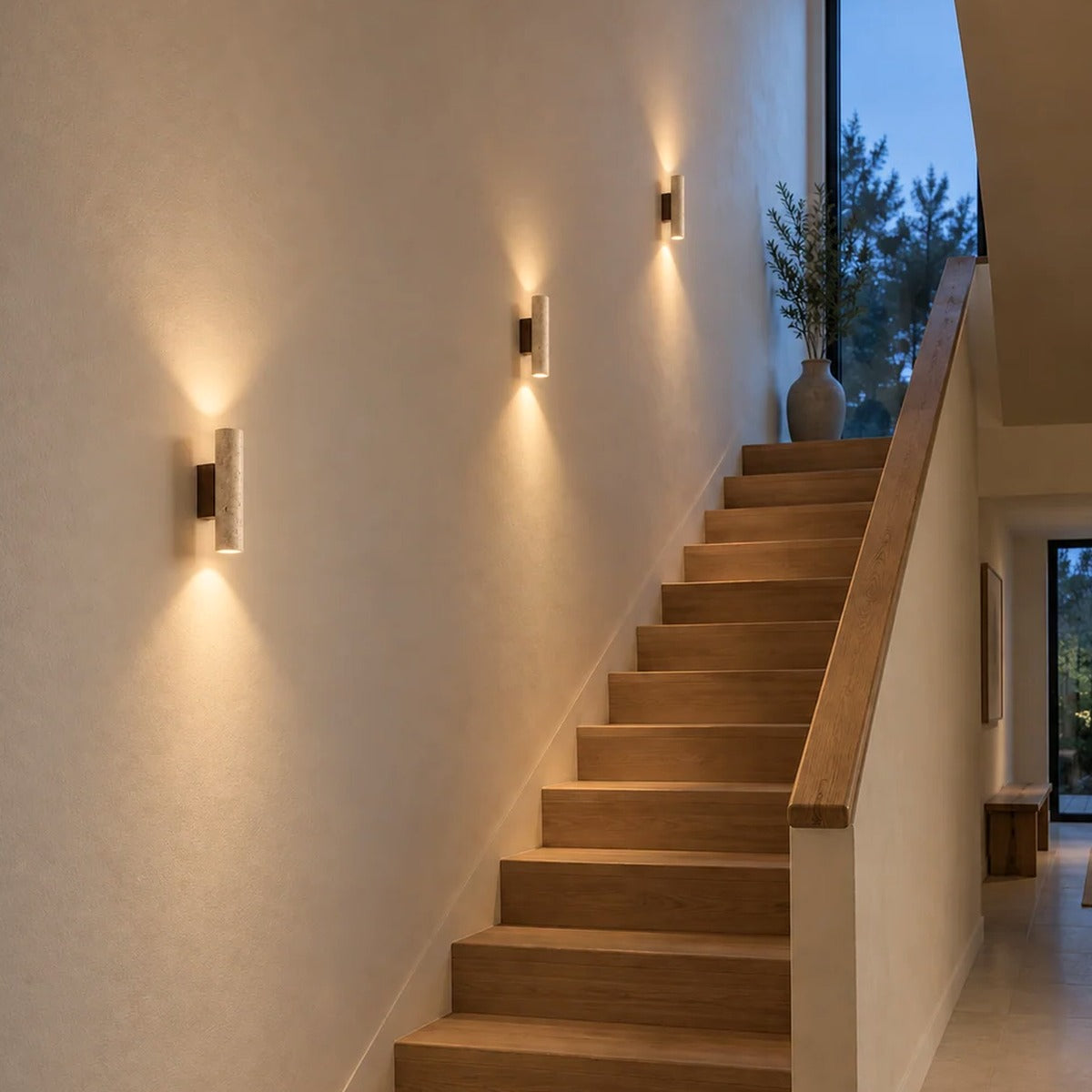 Row of Tarra travertine wall sconces along a staircase