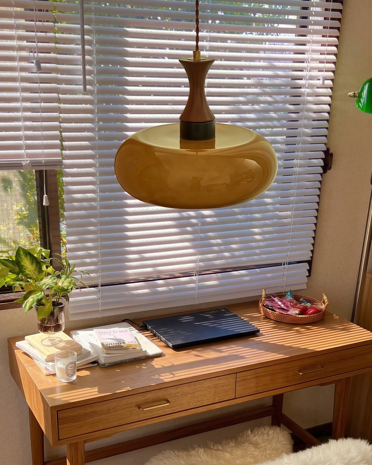 Ovia amber saucer pendant above a home office desk