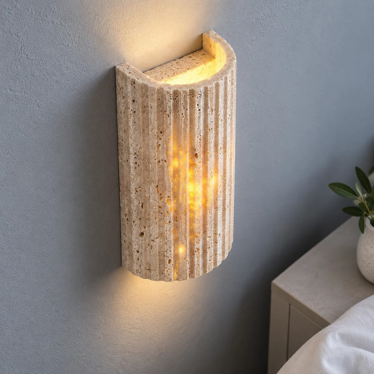 Close-up of light glowing through the natural pores of the Talia travertine