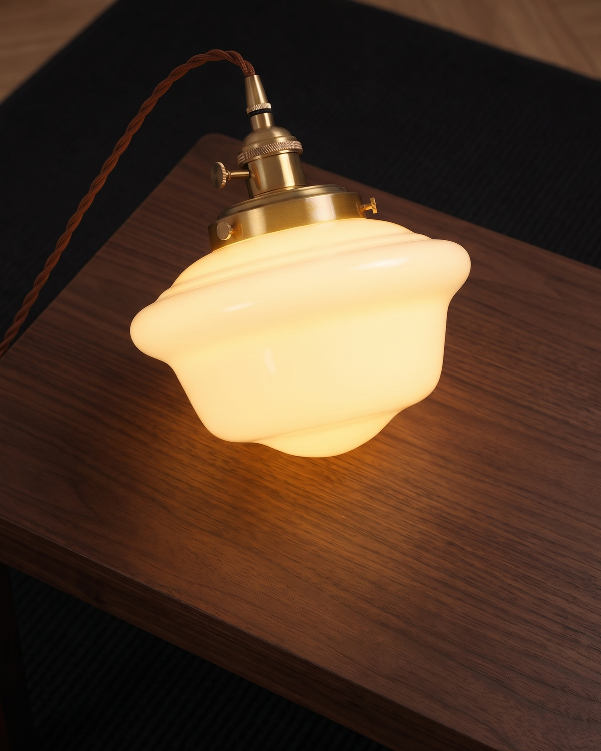 Elsie milk glass pendant light lit with a warm glow