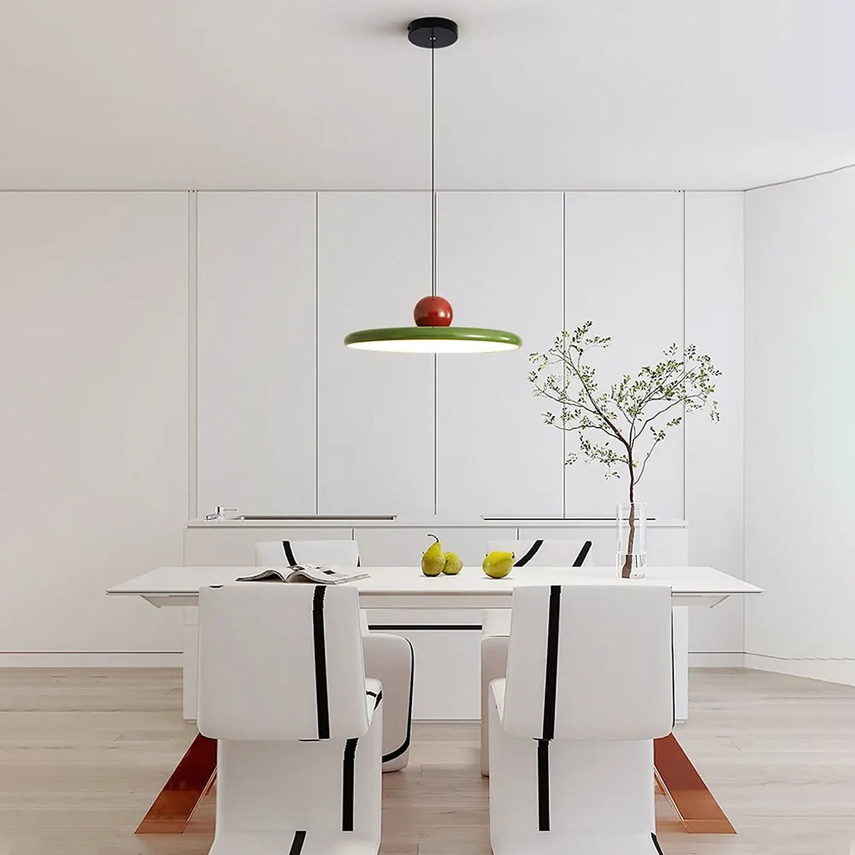 Green and red Juno saucer pendant light in a white dining room
