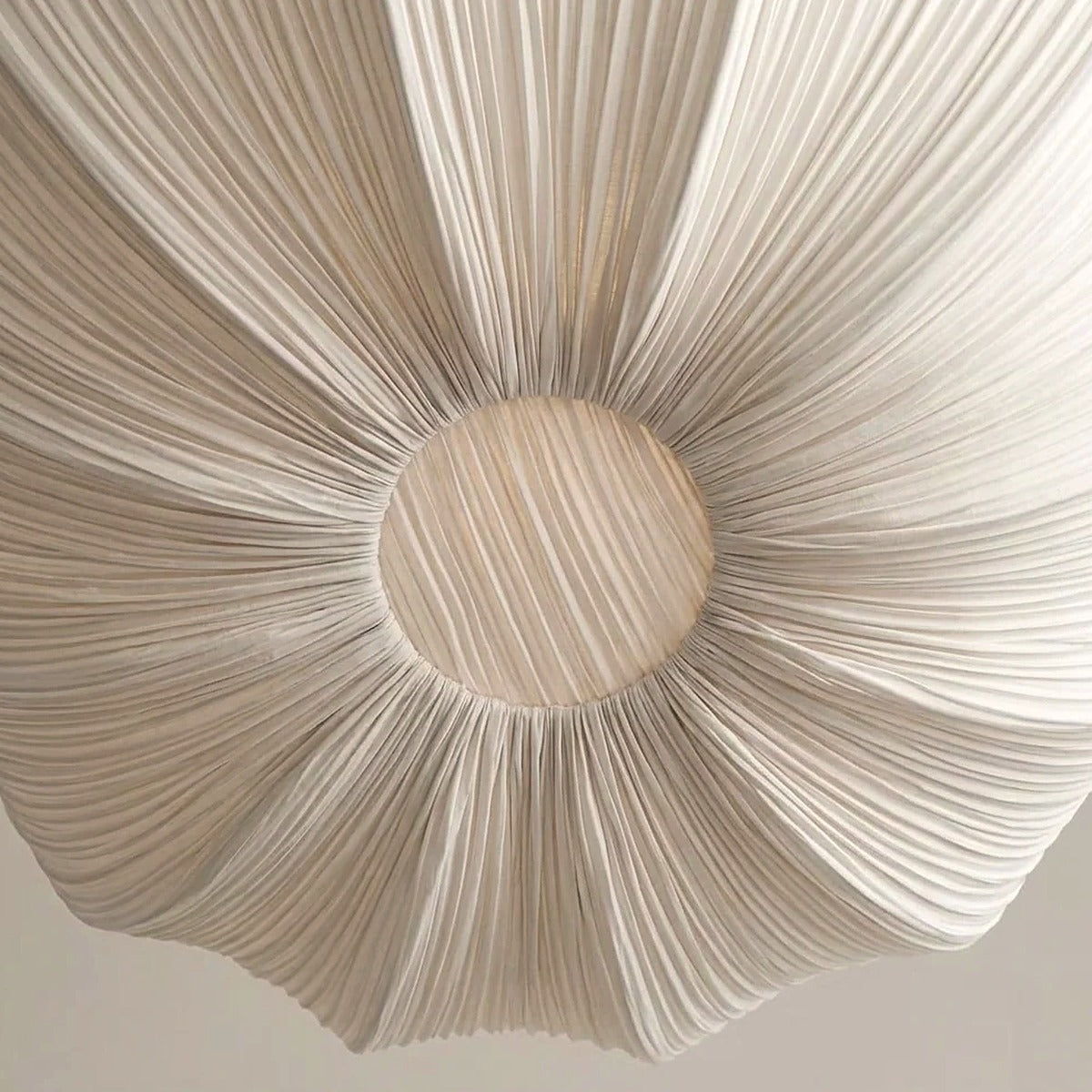 Pleated fabric detail of the Maris chandelier seen from below