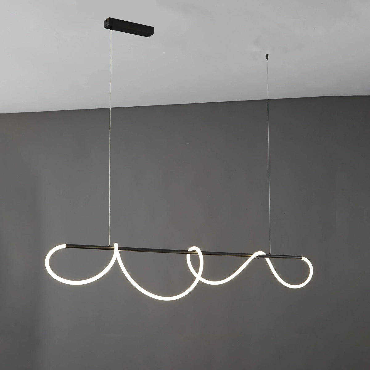 Black Ondine wave LED linear pendant light, 59.1 in, lit