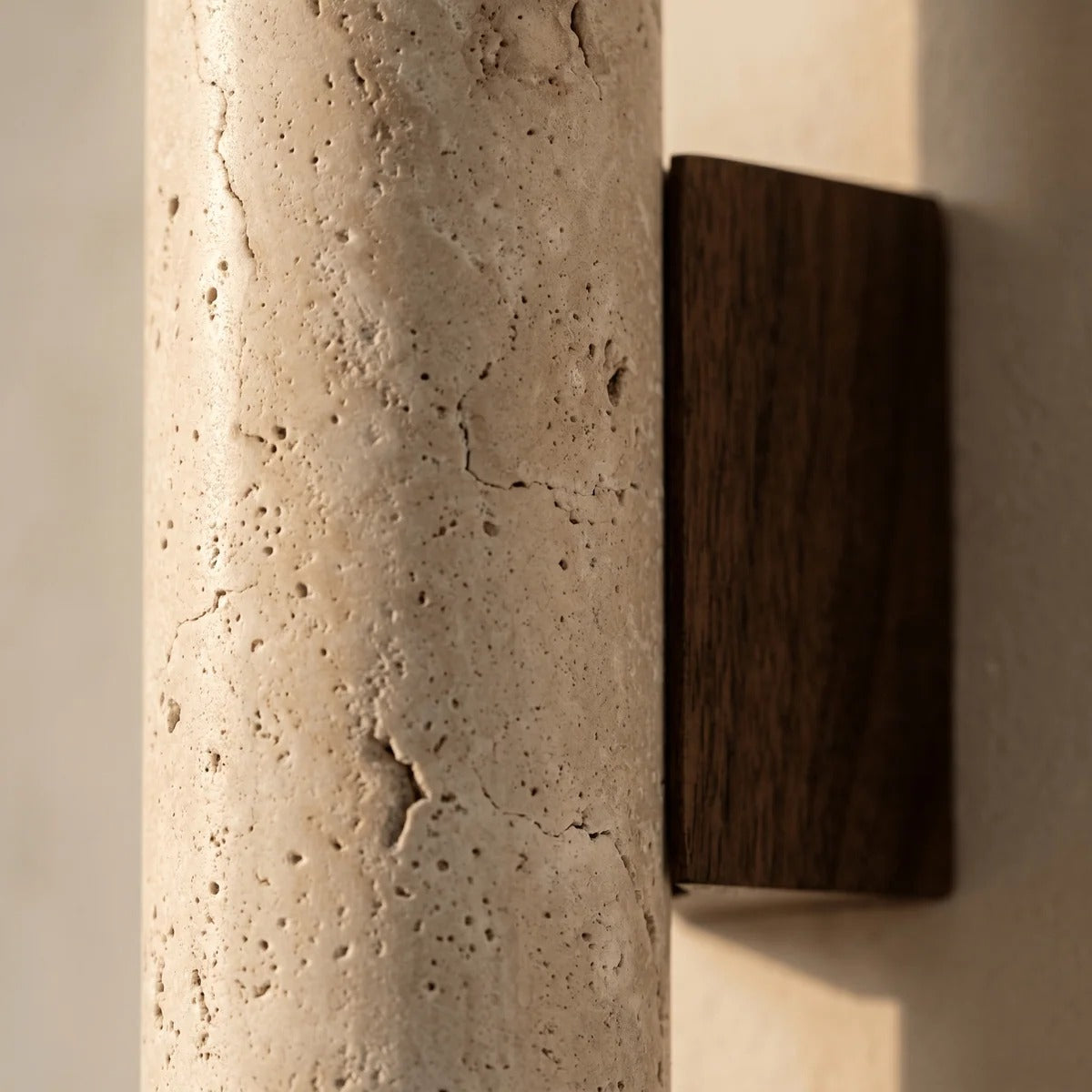 Natural travertine texture with open pores on the Tarra sconce