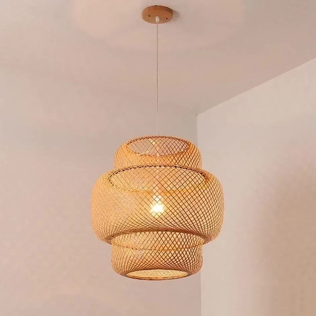 Close-up of the Toki bamboo lantern lit, showing the woven tiers