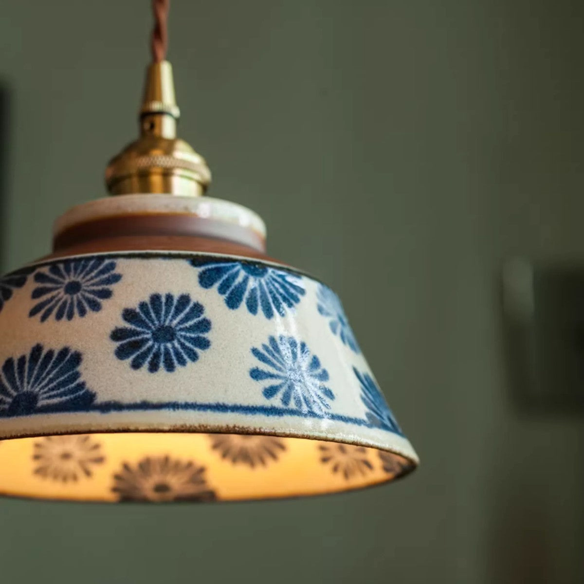 Detail of the hand-painted blue flower glaze on the Hana ceramic shade