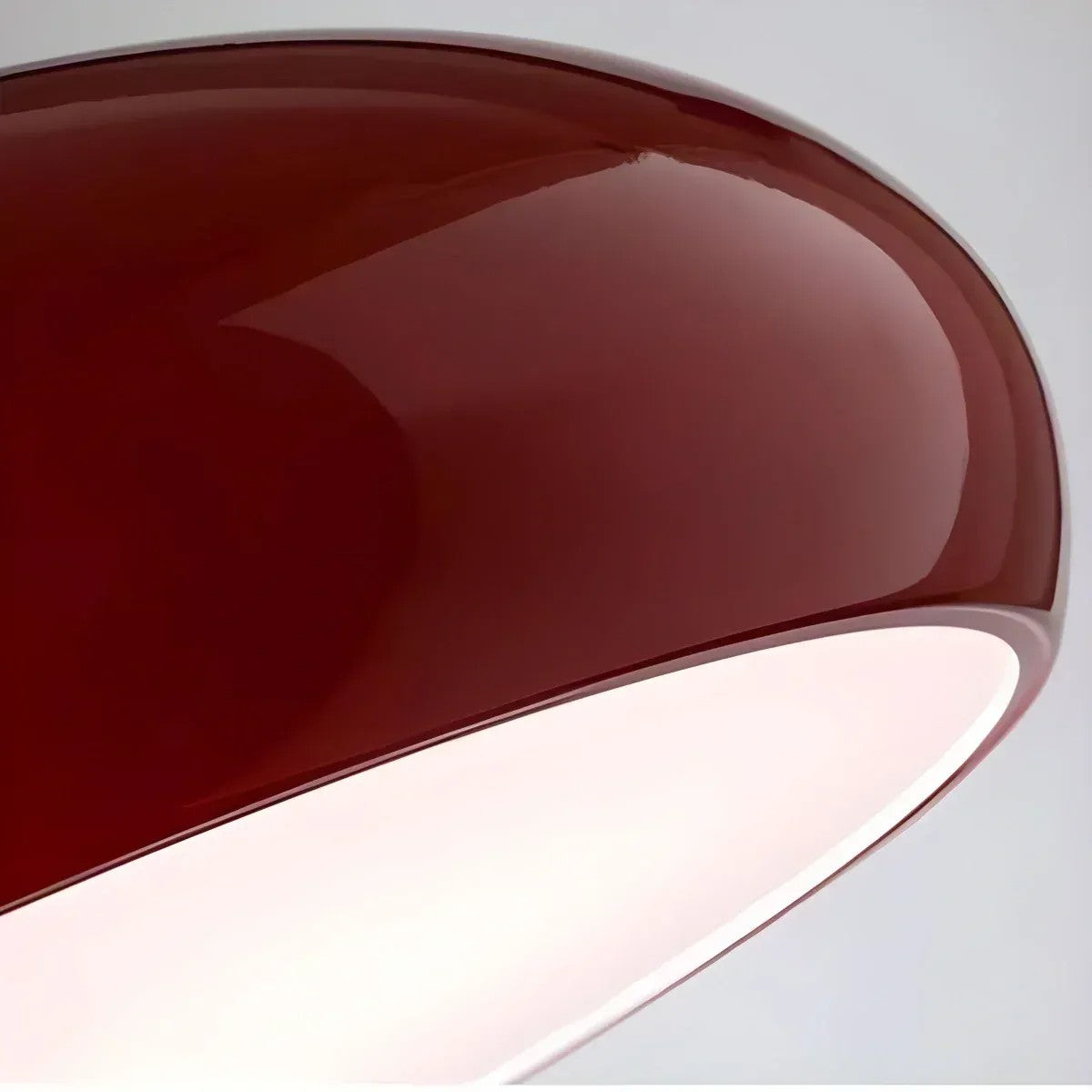 Close-up of the high-gloss wine red finish of the Lola pendant