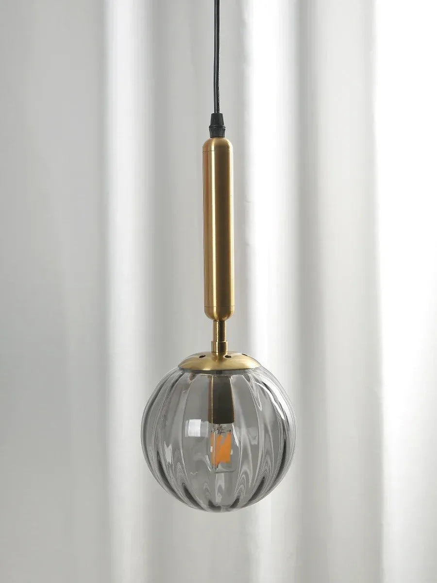 Coco glass globe pendant light, gold stem with smoke gray ribbed glass