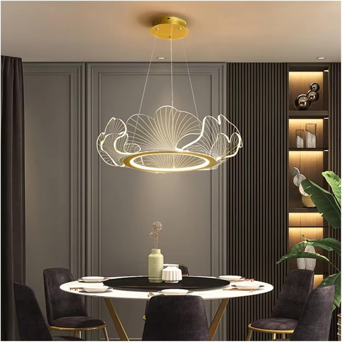 Elara gold ginkgo leaf ring chandelier above a round dining table