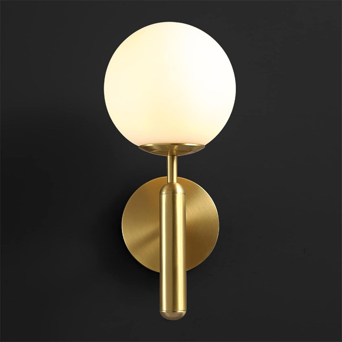 Elio globe wall sconce in gold with a frosted white globe, front view