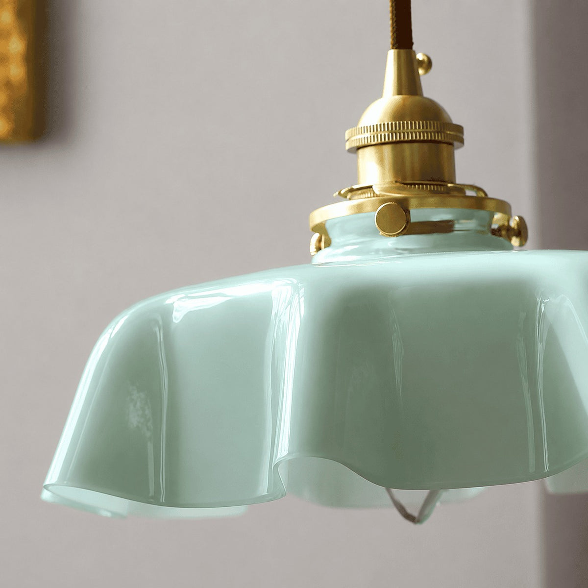 Close-up of the Fleur green scalloped glass shade
