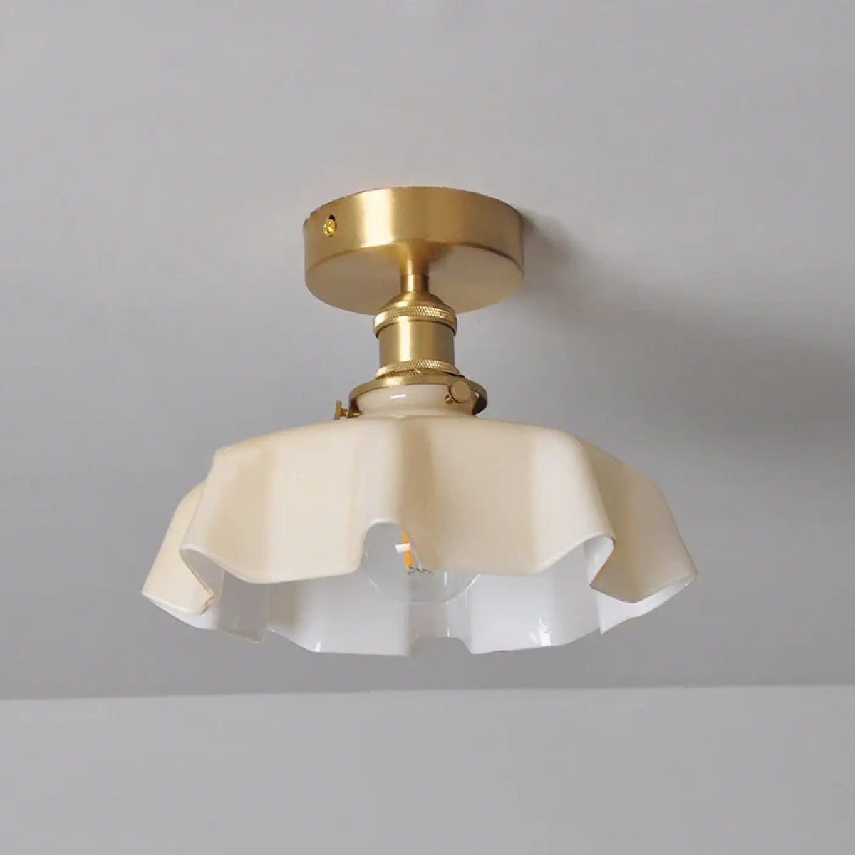Fleur scalloped glass semi-flush ceiling light in white with brass-finish mount